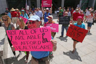 <p>People march during a protest against the Republican bill in the U.S. Senate to replace President Barack Obama’s health care law Tuesday, June 27, 2017, in Salt Lake City. Demonstrators with Utah’s Disabled Rights Action Committee chanted and carried signs while blocking State Street Tuesday afternoon. Utah protesters criticized Utah Republican Sen. Orrin Hatch for supporting the bill and say it will cut life-saving Medicaid services and other health protections. (Photo: Rick Bowmer/AP) </p>