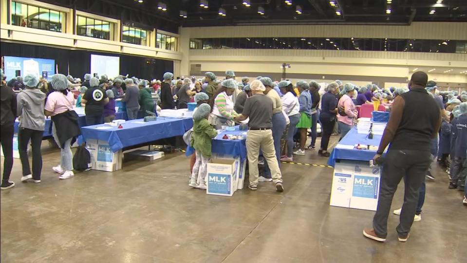 Many families honored Dr. Martin Luther King Jr. by helping others at the Orange County Convention Center.