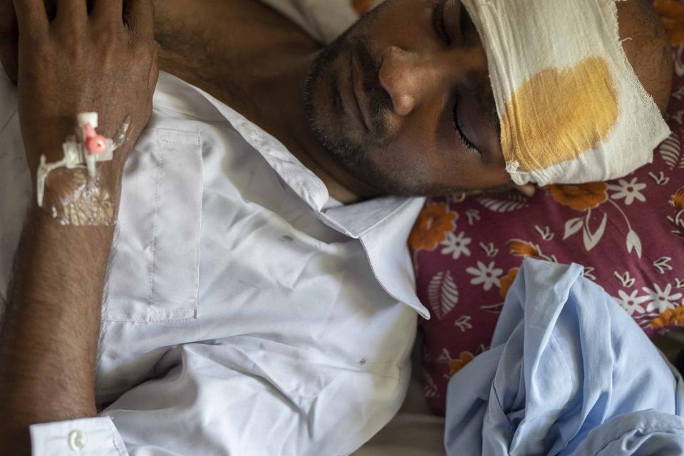 A passenger who was injured in Friday's train accident receives treatment at a hospital in Balasore district, in the eastern state of Orissa, India, Sunday, June 4, 2023. The train derailment in eastern India that killed more than 300 people and injured hundreds more was caused by an error in the electronic signaling system that led a train to wrongly change tracks, India’s railways minister said Sunday. (AP Photo/Rafiq Maqbool)