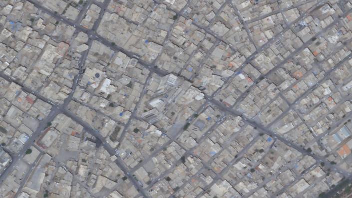 This satellite photo from Planet Labs PBC shows the Metropol Building site, center, in Abadan, Iran, April 20, 2022. Iranian riot police fired tear gas and shot into the air to disperse an angry crowd of hundreds of people near the site of the Metropol building collapse in the southwestern city of Abadan, online video analyzed Saturday, May 28, 2022, showed. (Planet Labs PBC via AP)