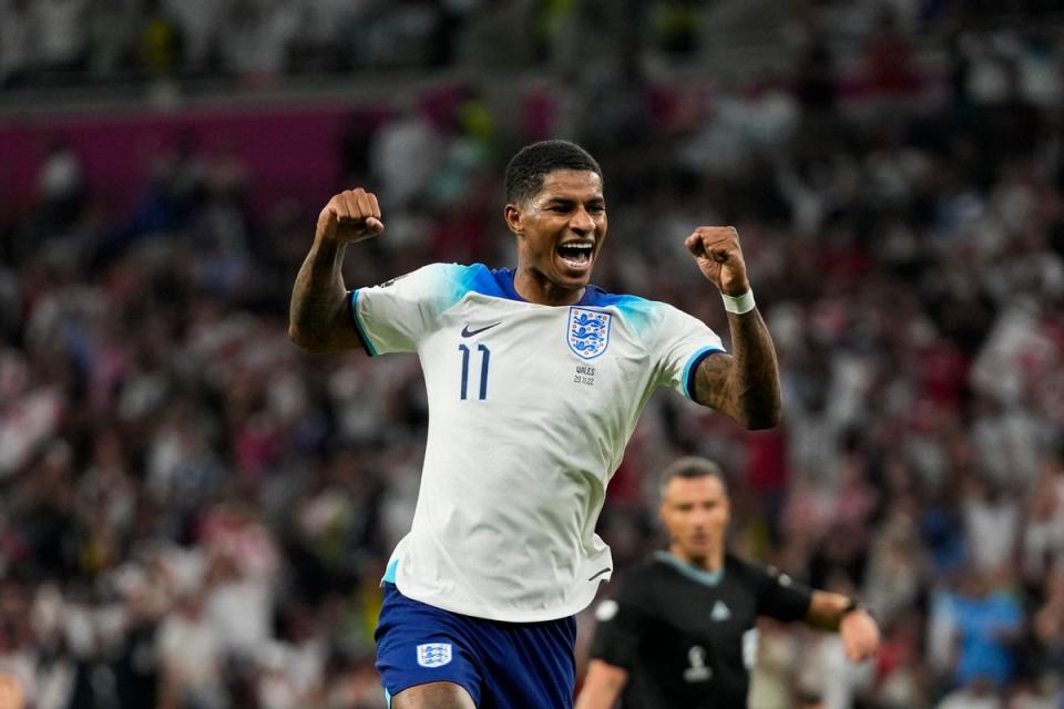 Rashford celebrates after scoring England’s third goal (AP)