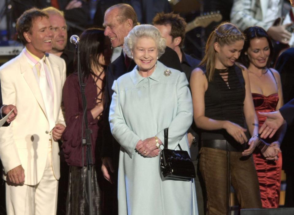 The Queen meets artists on stage in the gardens of Buckingham Palace, after the second concert to commemorate the Golden Jubilee (Stefan Rousseau/PA) (PA Archive)