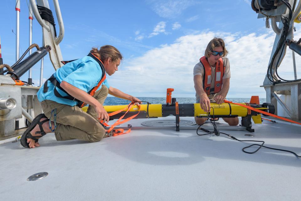 The team searching for the USS Nina was using an autonomous underwater vehicle to perform side-scan sonar and camera mapping of the site.