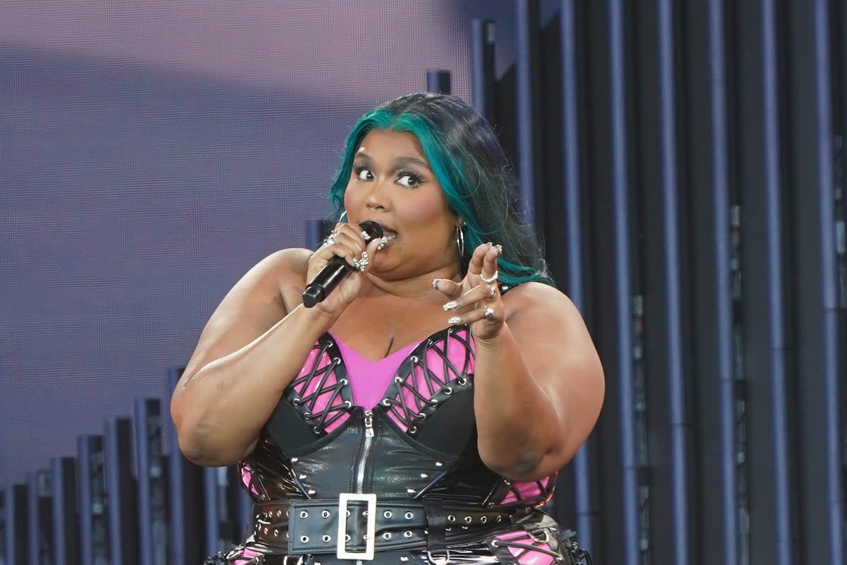 Lizzo on stage at Glastonbury Festival earlier this year  (PA)