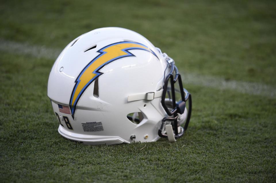 FILE - In this Sept. 1, 2016, file photo, a San Diego Chargers helmet sits on the field before a preseason NFL football game against the San Francisco 49ers, in San Diego. The Chargers are moving to Los Angeles, where they will join the recently relocated Rams in giving the nation's second-largest media market two NFL teams for the first time in decades. The announcement was made Thursday, Jan. 12, 2017. (AP Photo/Denis Poroy, FIle)