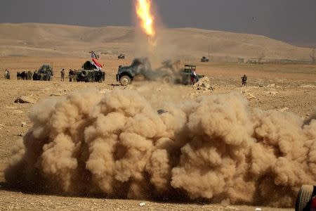 Smoke rises after members of the Iraqi rapid response forces fired a missile towards Islamic State militants during a battle in the south of Mosul, Iraq February 19, 2017. REUTERS/Zohra Bensemra