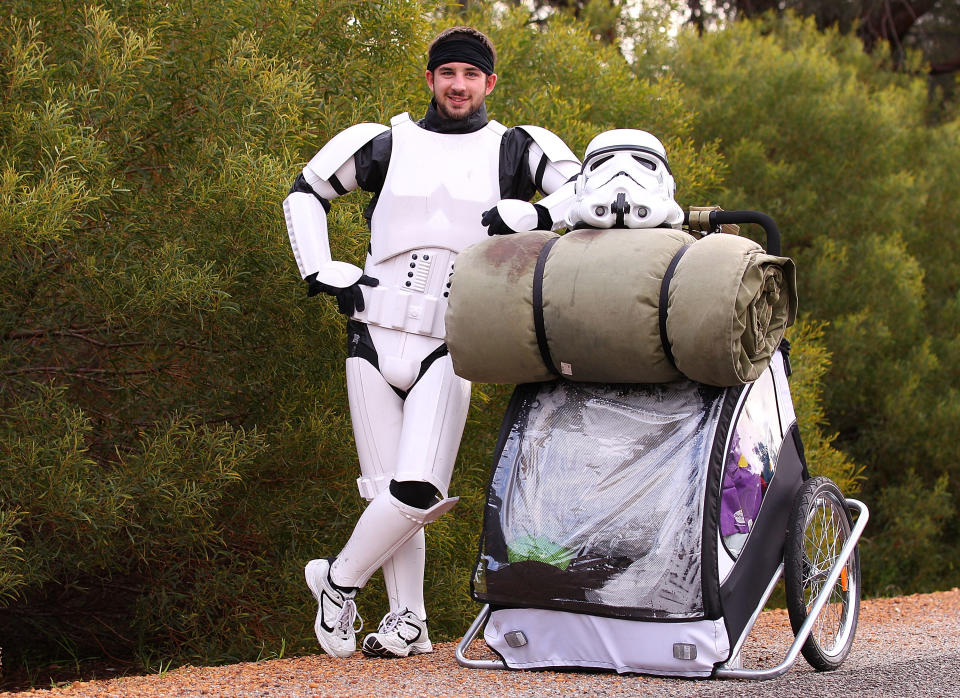 PERTH, AUSTRALIA - JULY 15: Stormtrooper Paul French is pictured on day 5 of his over 4,000 kilometre journey from Perth to Sydney taking a rest break on Old Mandurah Road on July 15, 2011 in Perth, Australia. French aims to walk 35-40 kilometres a day, 5 days a week, in full Stormtrooper costume until he reaches Sydney. French is walking to raise money for the Starlight Foundation - an organisation that aims to brighten the lives of ill and hostpitalised children in Australia. (Photo by Paul Kane/Getty Images)