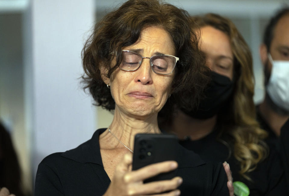 Alessandra Sampaio speaks to the media during the funeral of her husband British journalist Dom Phillips at the Parque da Colina cemetery in Niteroi, Brazil, Sunday, June 26, 2022. Family and friends paid their final respects to Phillips who was killed in the Amazon region along with the Indigenous expert Bruno Pereira. (AP Photo/Silvia Izquierdo)