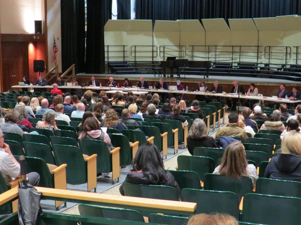 Five days after two students were arrested with a gun at Morris Knolls High School, parents, teachers and students speak out at a board of education meeting on March 27.