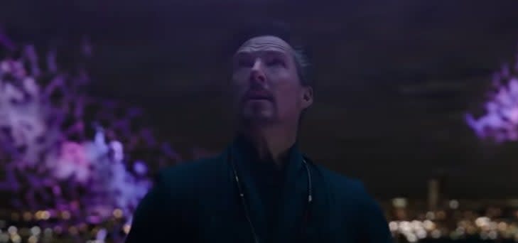 Doctor Strange looking up at purple rifts in the sky in "Spider-Man: No Way Home"