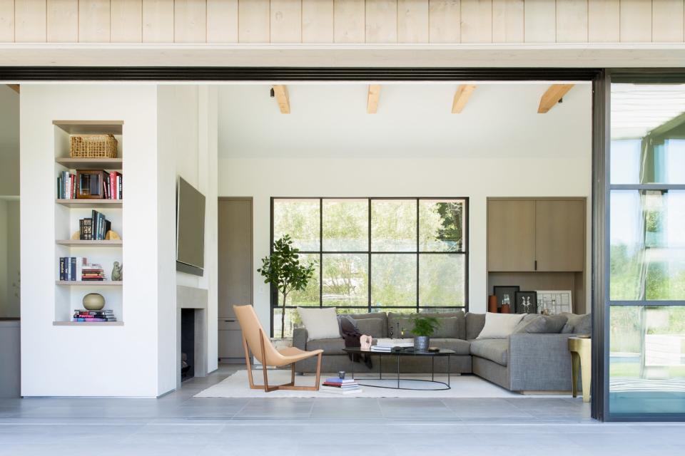 The living room brings the outdoors in with a large sliding wall.