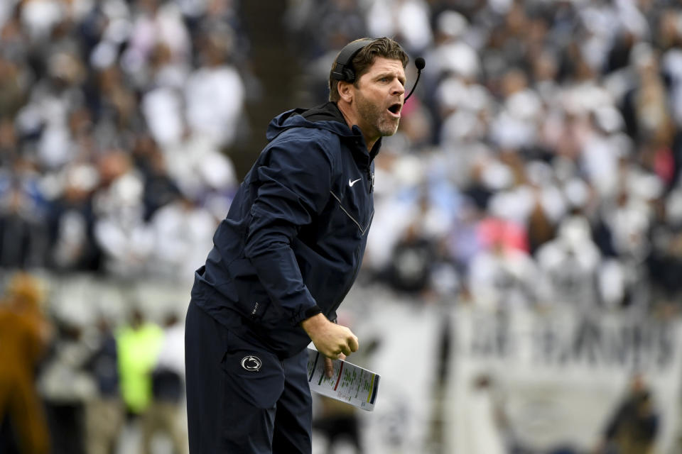 FILE - Penn State defensive coordinator Brent Pry coaches against Illinois during an NCAA college football game in State College, Pa. on Saturday, Oct. 23, 2021. Virginia Tech is finalizing a deal to make Penn State defensive coordinator Brent Pry its next head coach, two people familiar with the situation told The Associated Press. The people spoke to the AP on condition of anonymity Tuesday, Nov. 30, because details were still being worked out and neither school was prepared to make a formal announcement.(AP Photo/Barry Reeger, File)