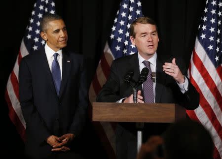 U.S. Senator Michael Bennet (D-CO) introduces U.S. President Barack Obama to deliver remarks at a Democratic Party fundraiser in Atlanta, Georgia, in this May 19, 2013 file photo. REUTERS/Jason Reed/Files