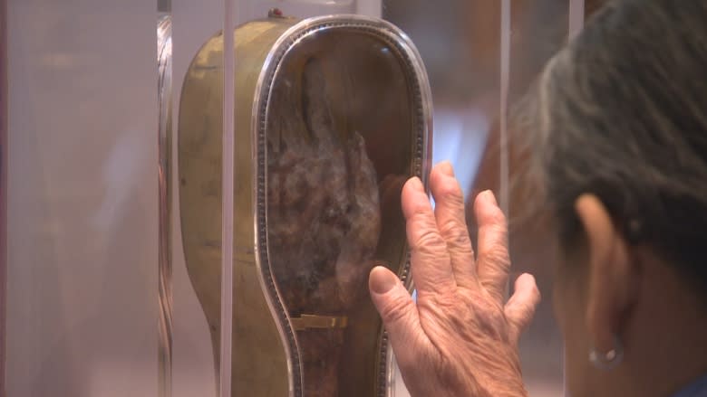 Faithful, curious fill Winnipeg church to view severed forearm of St. Francis Xavier