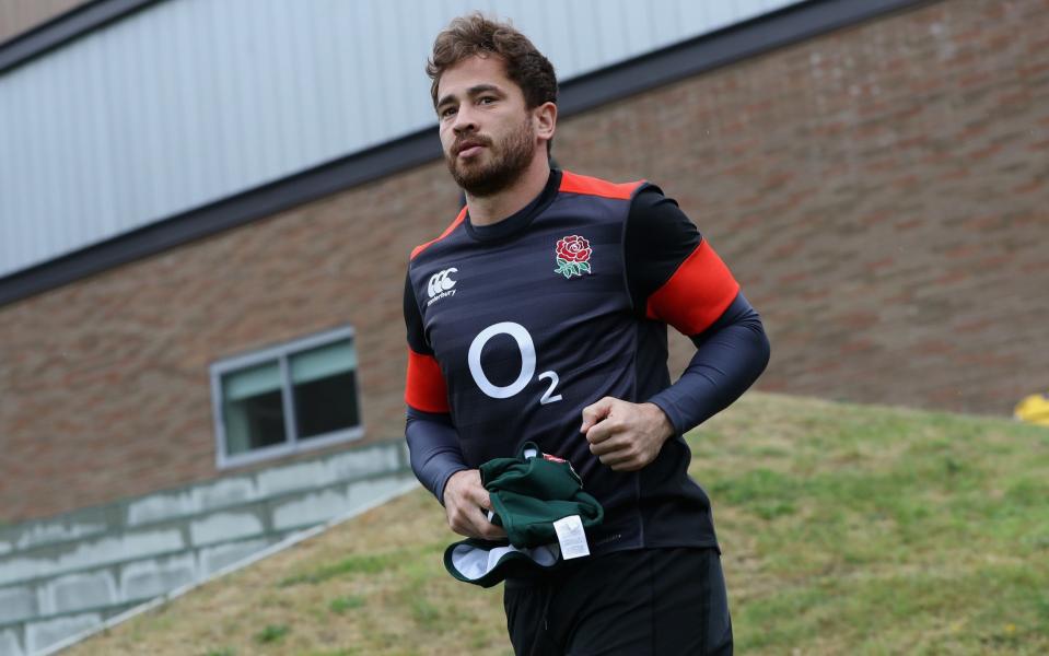 Danny Cipriani runs onto the pitch during the England training session held at Pennyhill Park - Getty Images Europe
