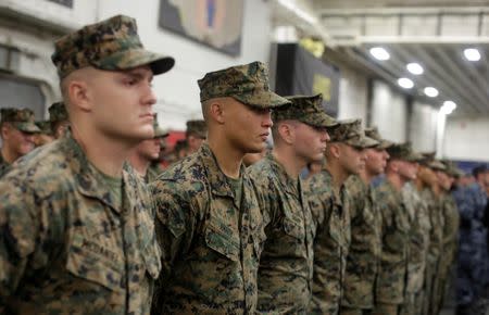 U.S. Marines aboard the USS Bonhomme Richard amphibious assault ship stand in formation during a ceremony marking the start of Talisman Saber 2017, a biennial joint military exercise between the United States and Australia aboard the USS Bonhomme Richard amphibious assault ship on the the Pacific Ocean off the coast of Sydney, Australia, June 29, 2017. REUTERS/Jason Reed