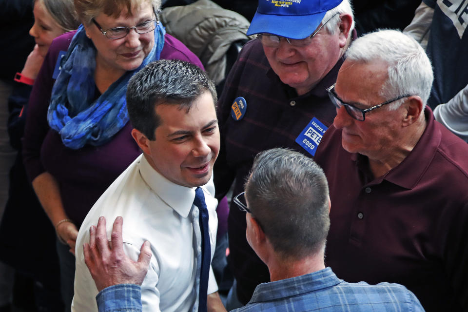 Democratic presidential candidate former South Bend, Ind., Mayor Pete Buttigieg, center, greets supporters following a town hall meeting at the University of Dubuque in Dubuque, Iowa, Wednesday, Jan. 22, 2020. (AP Photo/Gene J. Puskar)