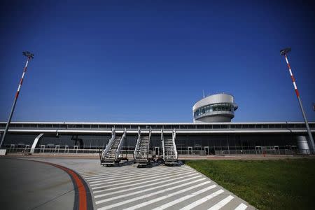 Passenger stairs are seen in front of the airport in Lodz October 10, 2014. REUTERS/Kacper Pempel