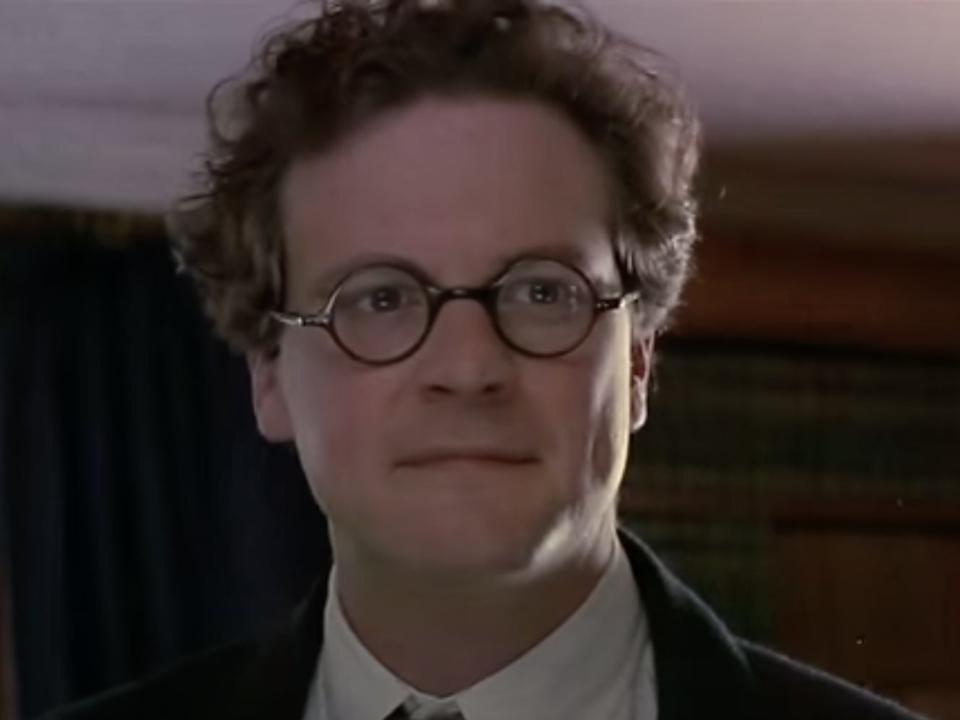 Colin Firth wearing circular glasses.