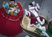 A participant dressed as Santa Clause makes his way down 6th Ave. during the 87th Macy's Thanksgiving day parade in New York November 28, 2013. REUTERS/Carlo Allegri (UNITED STATES - Tags: ENTERTAINMENT BUSINESS SOCIETY)