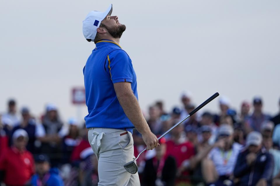 Team Europe's Tyrrell Hatton reacts after missing a putt on the 15th hole during a four-ball match the Ryder Cup at the Whistling Straits Golf Course Friday, Sept. 24, 2021, in Sheboygan, Wis. (AP Photo/Jeff Roberson)