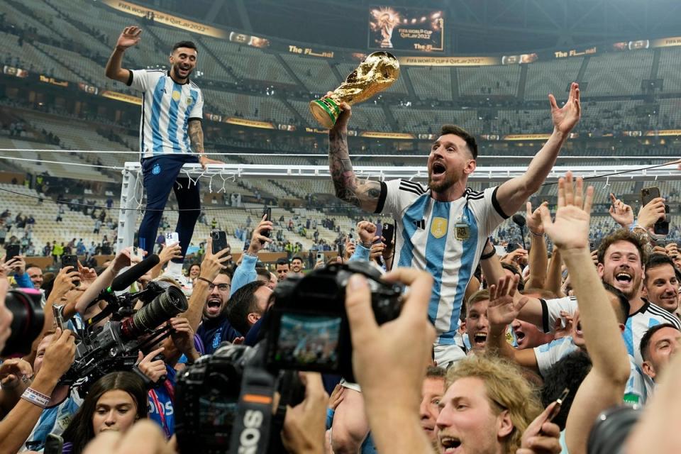 Messi celebrates with the World Cup after Argentina’s glory (AP)