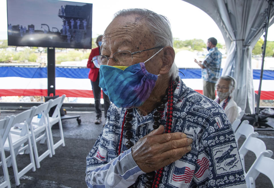 U.S. Army veteran Arthur Shak, 96, salutes during ceremonies aboard the USS Missouri, marking the 75th anniversary of the Japanese surrender that ended World War II, in Honolulu, Wednesday, Sept. 2, 2020. (Craig T. Kojima/Honolulu Star-Advertiser via AP, Pool)