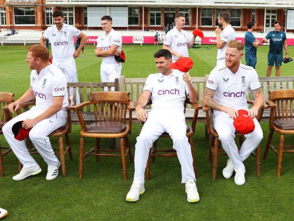 Jonny Bairstow, James Anderson and Stokes sit down for a photoshoot as the rest of the team assemble (Getty)