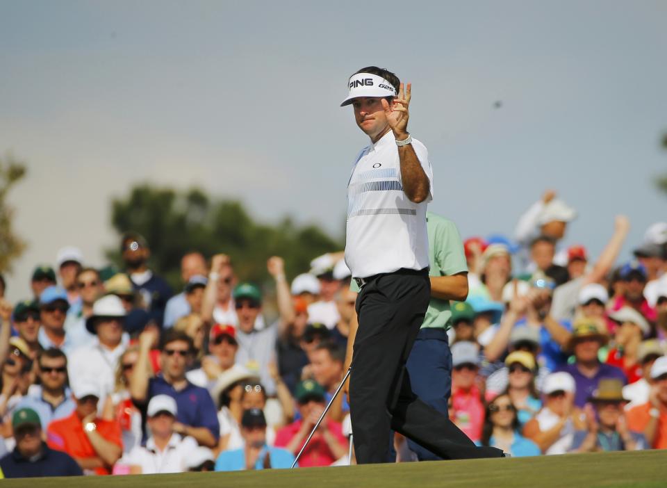 U.S. golfer Bubba Watson reacts after a birdie on the ninth hole during the final round of the Masters golf tournament at the Augusta National Golf Club in Augusta, Georgia April 13, 2014. REUTERS/Brian Snyder (UNITED STATES - Tags: SPORT GOLF)