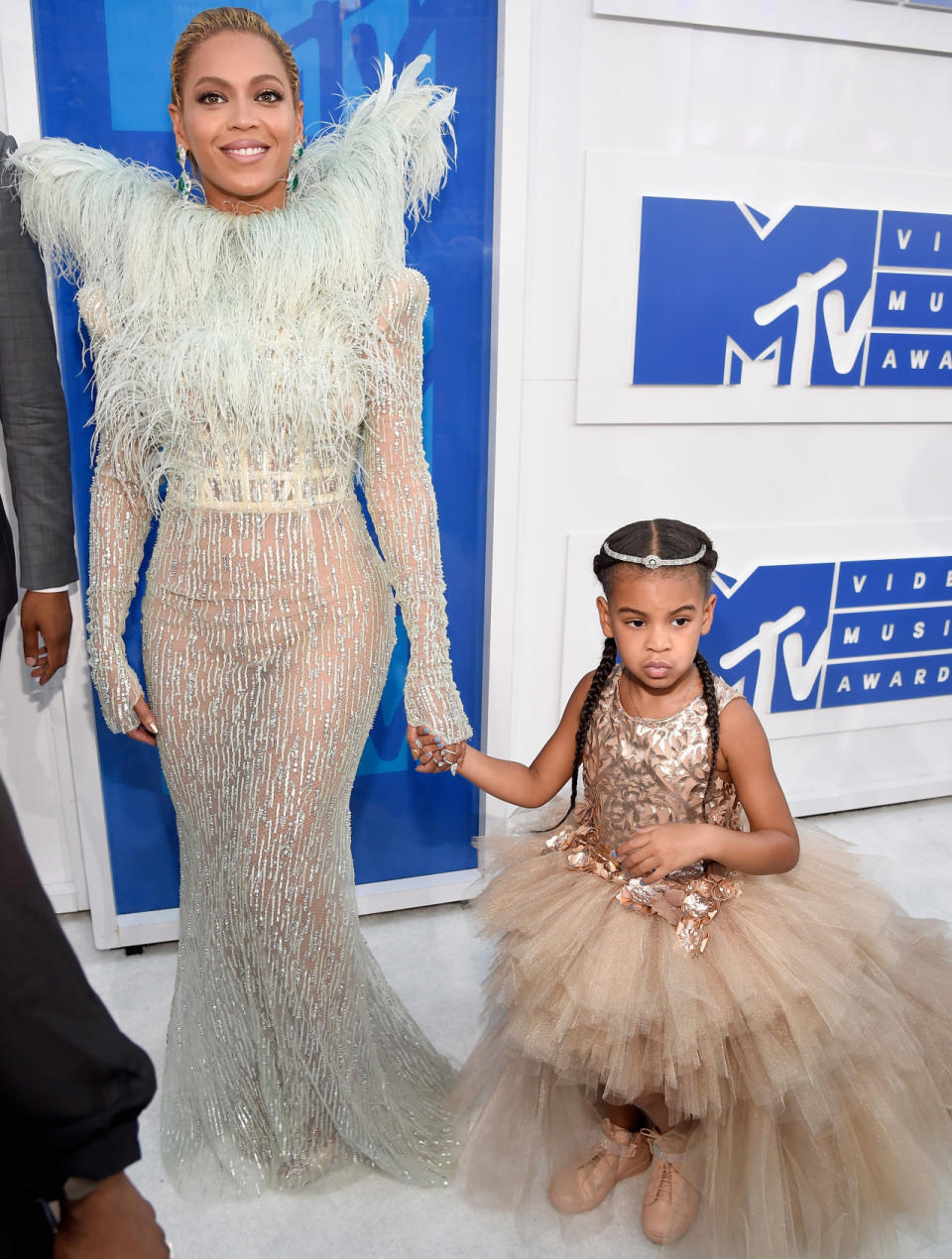 <p>Blue Ivy was back at the VMAs in August 2016 and in high fashion. She was spotting an $11,000 outfit — and that was just the dress. She also had on a diamond tiara and custom hightop sneakers. It was just her second carpet, but she was a pro. (Photo: Kevin Mazur/WireImage) </p>
