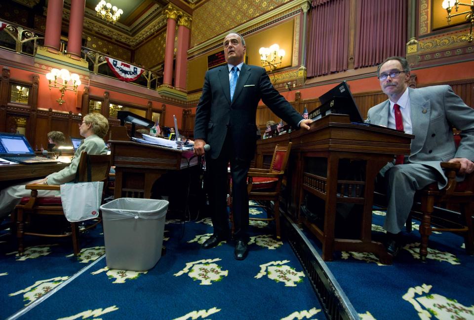 Connecticut House Minority Leader Larry Cafero, R-Norwalk, center, and Rep. Arthur O'Neill, R-Southbury, right, listen to a speaker during a special session at the Capitol in Hartford, Conn., Tuesday, June 12, 2012. (AP Photo/Jessica Hill)