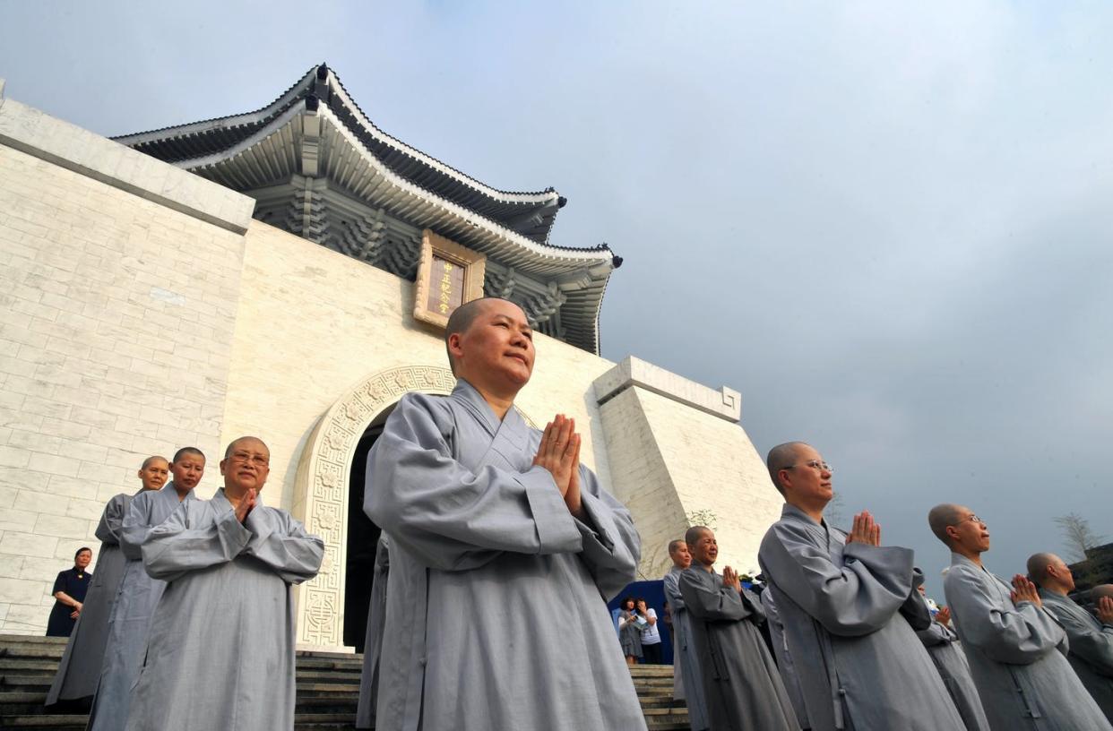 <span class="caption">Nuns from Taiwan pray in Taipei on May 8, 2011, in celebration of the Buddha's birth anniversary. </span> <span class="attribution"><a class="link " href="https://www.gettyimages.com/detail/news-photo/nuns-from-taiwans-leading-buddhist-group-tzu-chi-pray-news-photo/118383698?adppopup=true" rel="nofollow noopener" target="_blank" data-ylk="slk:Patrick Lin/AFP via Getty Images;elm:context_link;itc:0;sec:content-canvas">Patrick Lin/AFP via Getty Images</a></span>