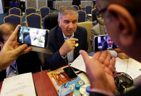 FILE PHOTO: Iran's OPEC governor Hossein Kazempour Ardebili talks to the media at the OPEC Ministerial Monitoring Committee in Algiers, Algeria September 23, 2018. REUTERS/Ramzi Boudina