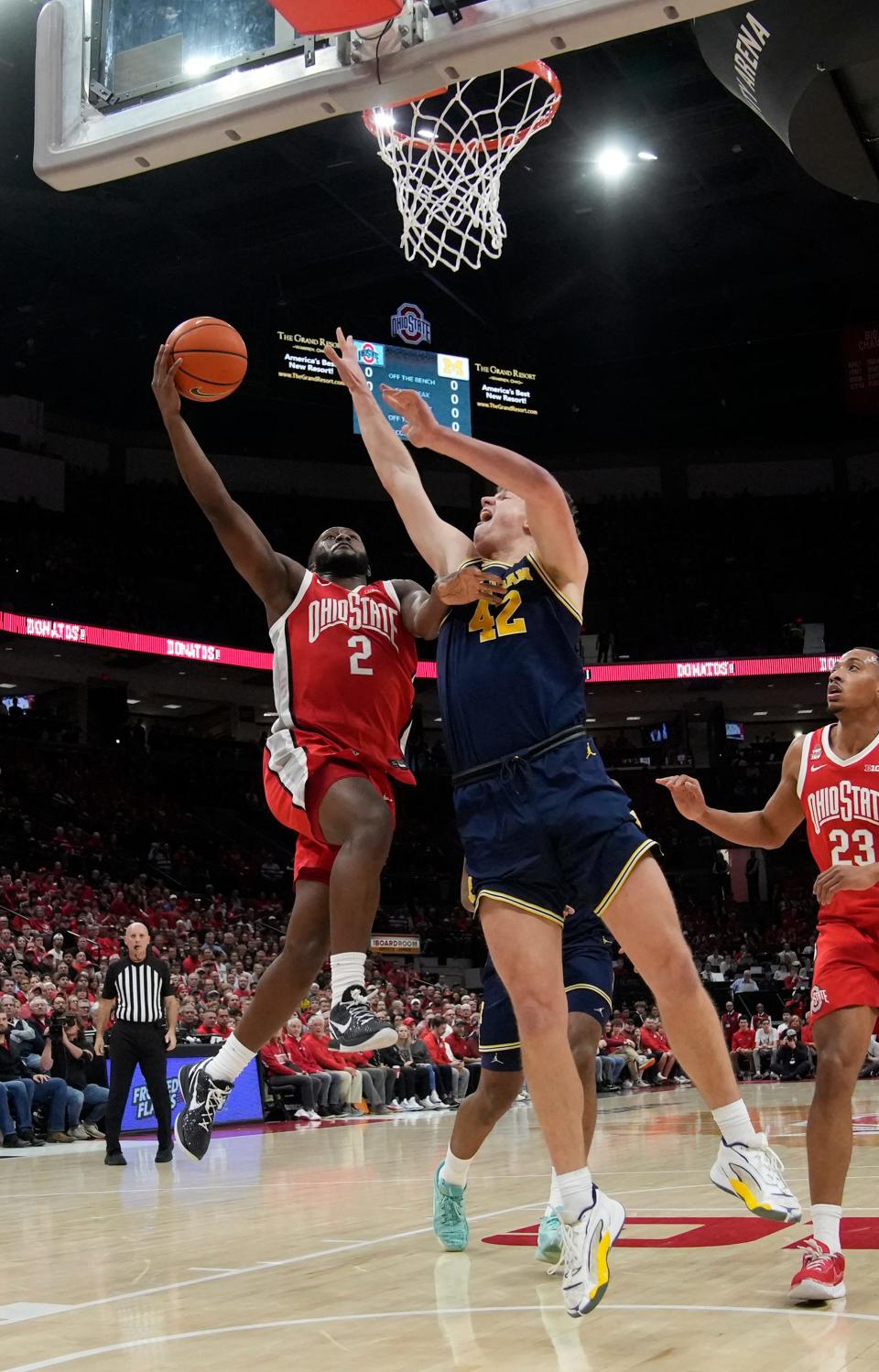 Mar 3, 2024; Columbus, OH, USA; Ohio State Buckeyes guard Bruce Thornton (2) scores while guarded by Michigan Wolverines forward Will Tschetter (42) during their NCAA Division I Mens basketball game at Value City Arena.