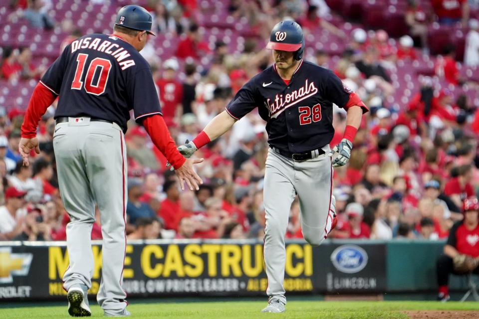 Washington Nationals left fielder Lane Thomas (28) rounds the bases after hitting his third home run of the game in the seventh inning of a baseball game against the Cincinnati Reds, Friday, June 3, 2022, at Great American Ball Park in Cincinnati. The Washington Nationals won, 8-5.