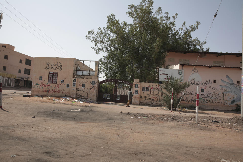 People walk outside a hospital in Khartoum, Sudan, Tuesday, Sept. 27, 2022. Sudanese medical officials warned Monday that more than 1,500 unidentified bodies piled up in several of the country’s morgues could lead to an outbreak of disease, amid accusations the government is covering up their causes of death. (AP Photo/Marwan Ali)