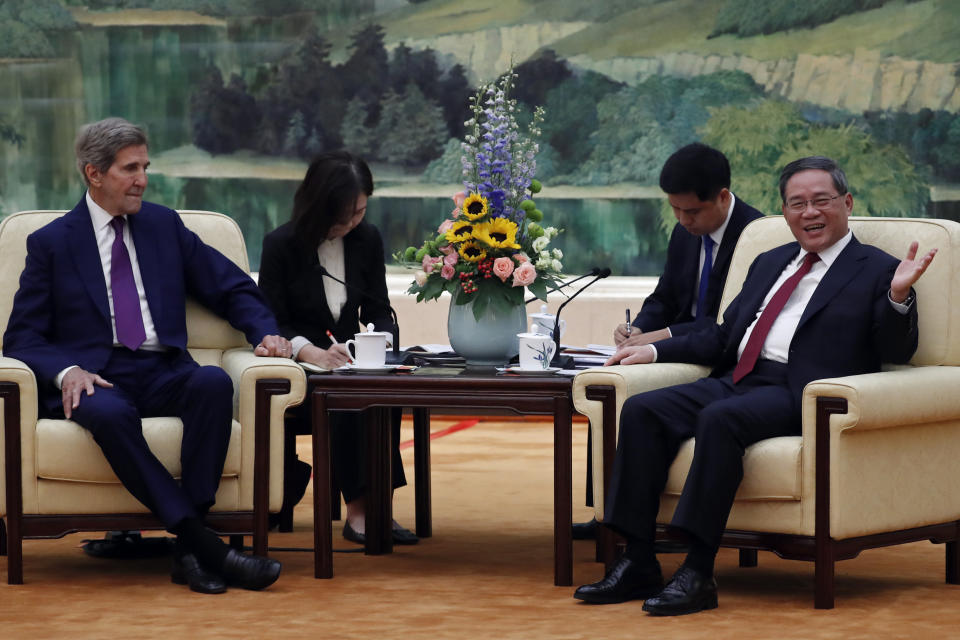 U.S. Special Presidential Envoy for Climate John Kerry, left, and Chinese Premier Li Qiang, right, attend a meeting at the Great Hall of the People in Beijing Tuesday, July 18, 2023. (Florence Lo/Pool Photo via AP)