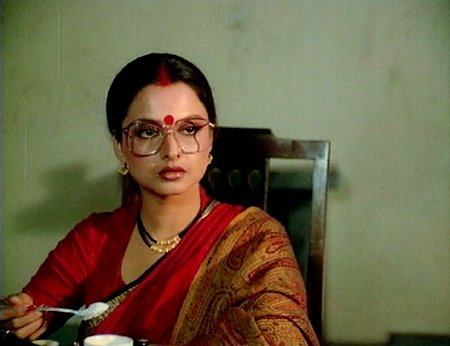 Rekha (Aastha): Rekha portrayed the role of Mansi, a housewife who is married to Om Puri but finds it difficult to make both ends meet to keep her household running. She is forced into prostitution to fulfill the needs of her family in this film. The film is directed by Basu Bhattacharya.