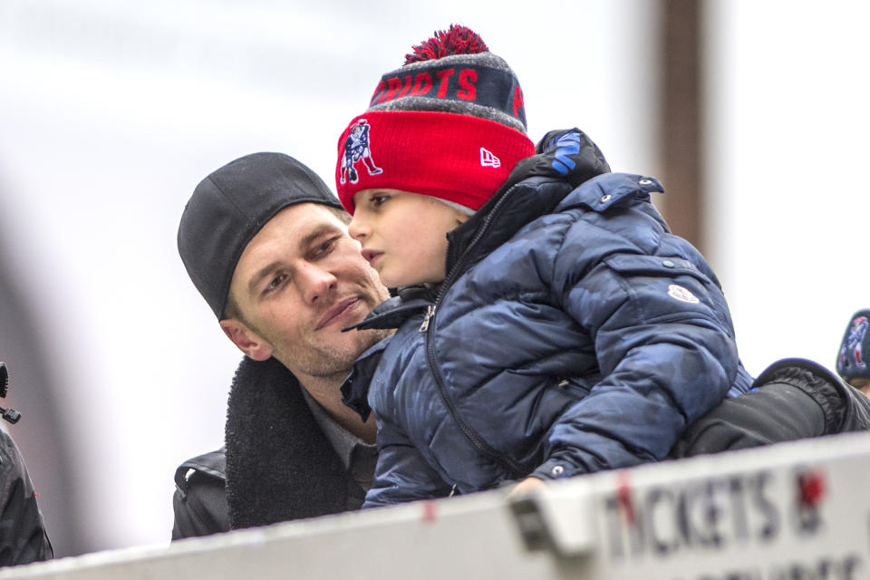 BOSTON, MA - FEBRUARY 07: Tom Brady of the New England Patriots celebrates with his son Benjamin during the Super Bowl victory parade on February 7, 2017 in Boston, Massachusetts. The Patriots defeated the Atlanta Falcons 34-28 in overtime in Super Bowl 51. (Photo by Billie Weiss/Getty Images)