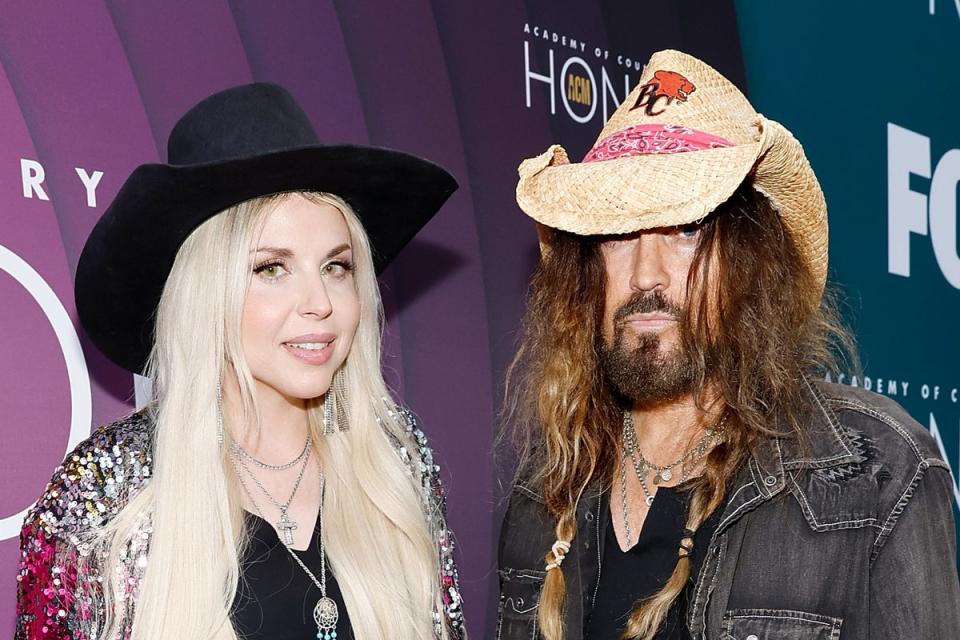 Miley Cyrus is believed not to approve of dad Billy Ray Cyrus' marriage to musician Firerose (left) who is 27 years his junior (Getty Images for ACM)