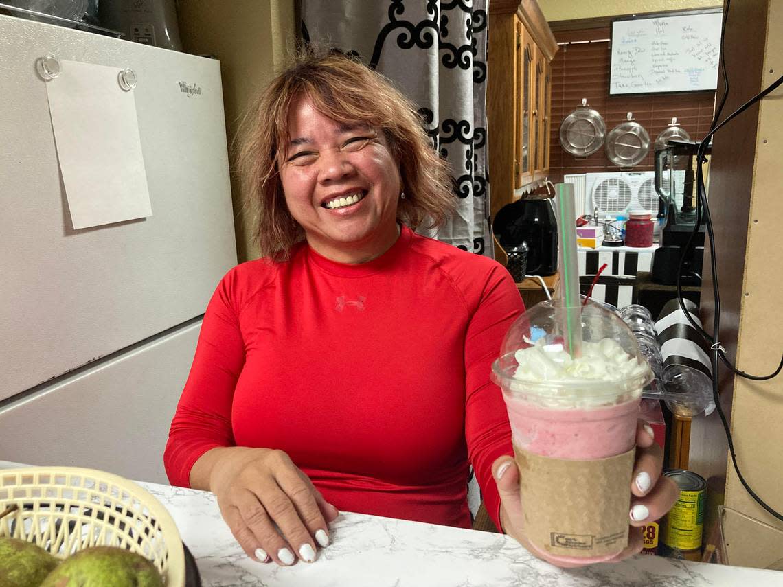 Lolita Glover, owner of a new coffee & gift shop in Warner Robins, serves up a frozen strawberry drink made simply with fresh strawberries, ice and white chocolate coffee creamer with whip cream and a cherry on top.