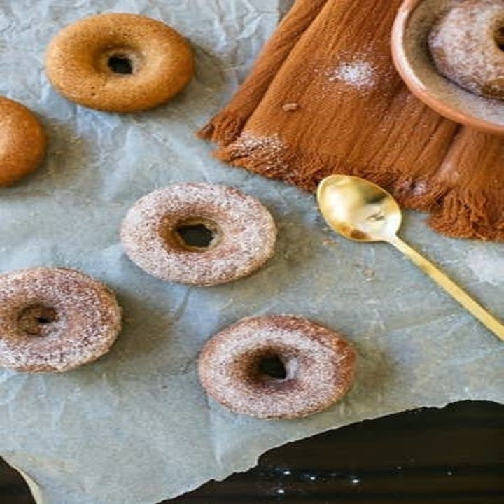 apple cider donuts on parchment paper