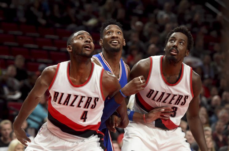 Robert Covington can't help but smile at all the attention he's getting. (AP)