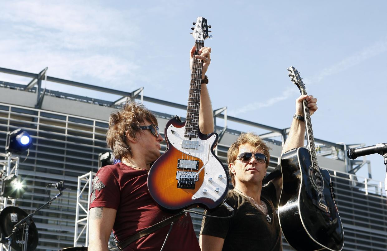 New Jersey natives Richie Sambora (left) and Jon Bon Jovi perform Oct. 22, 2009, during an invitation-only performance for 5,000 fan club contest winners and construction workers outside what is now MetLife Stadium in East Rutherford.
