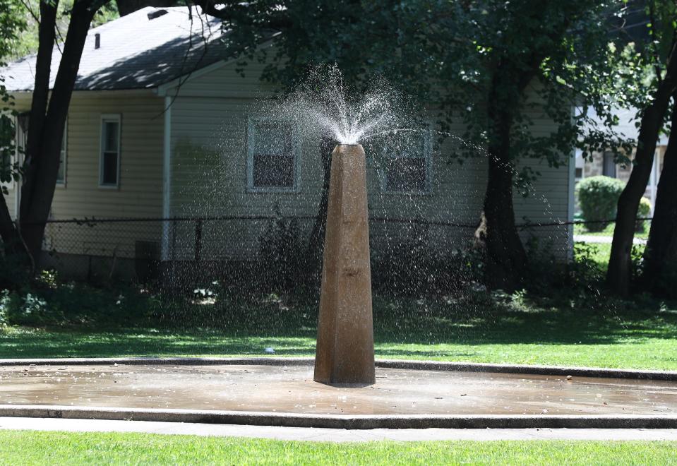 Shards of broken glass are peppered around the outdoor water fountain that was recently made operational inside the Leland Taylor Park in Louisville, Ky. on July 12, 2023.