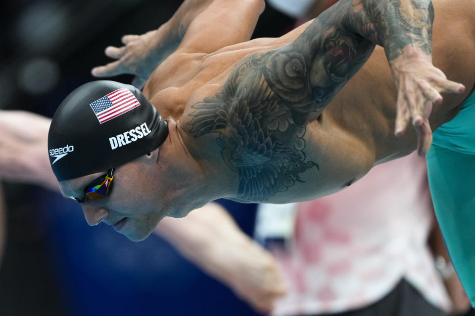 Caeleb Dressel, of United States, starts a men's 50-meter freestyle heat at the 2020 Summer Olympics, Friday, July 30, 2021, in Tokyo, Japan. (AP Photo/Gregory Bull)