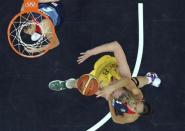 Great Britain's Azania Stewart (R) grabs Australia's Suzy Batkovic (2nd R) during their women's Group B basketball match at the London 2012 Olympic Games in the Basketball arena July 28, 2012.