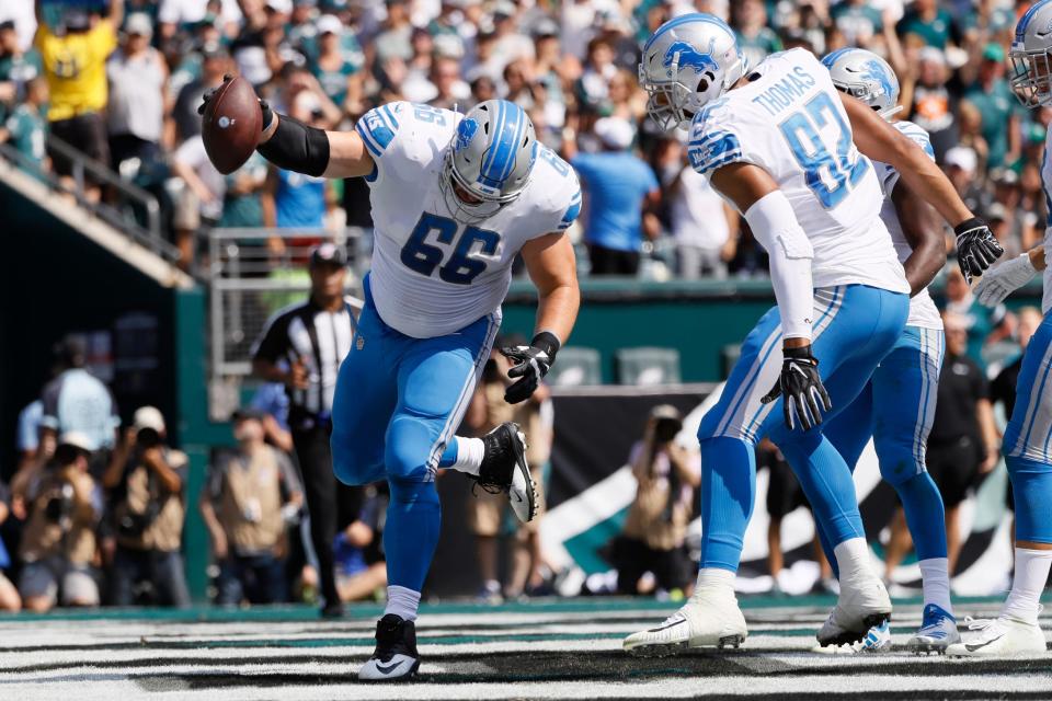 Joe Dahl spikes the ball after a Detroit Lions touchdown during the first half against the Philadelphia Eagles, Sept. 22, 2019, in Philadelphia.