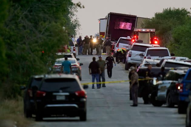 Police and other first responders work the scene where dozens of people were found dead and multiple others were taken to hospitals with heat-related illnesses Monday in Bexar County, Texas. (Photo: Eric Gay/Associated Press)