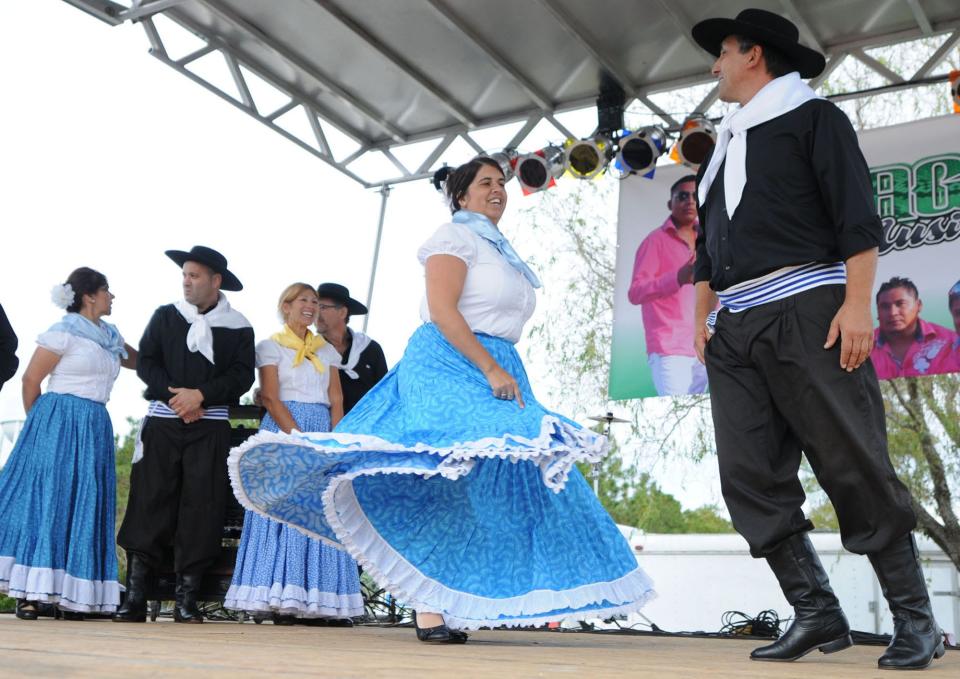 Members of Grupo Cimmaron perform traditional folklore dancing from Uruguay during the 16th annual Festival Latino at Ogden Park in Wilmington in 2014.